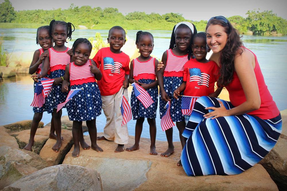  Amy with her seven adopted Ugandan children. 